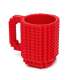 Taza de ladrillos de construcción color rojo